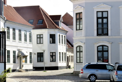 Picturesque old town with historic buildings, whose windows are equipped with sun protection film for improved heat insulation and energy savings.